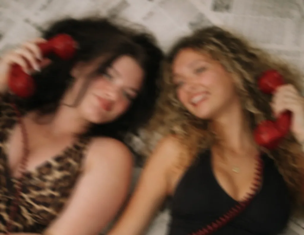 Alana and Mikayla with red phones