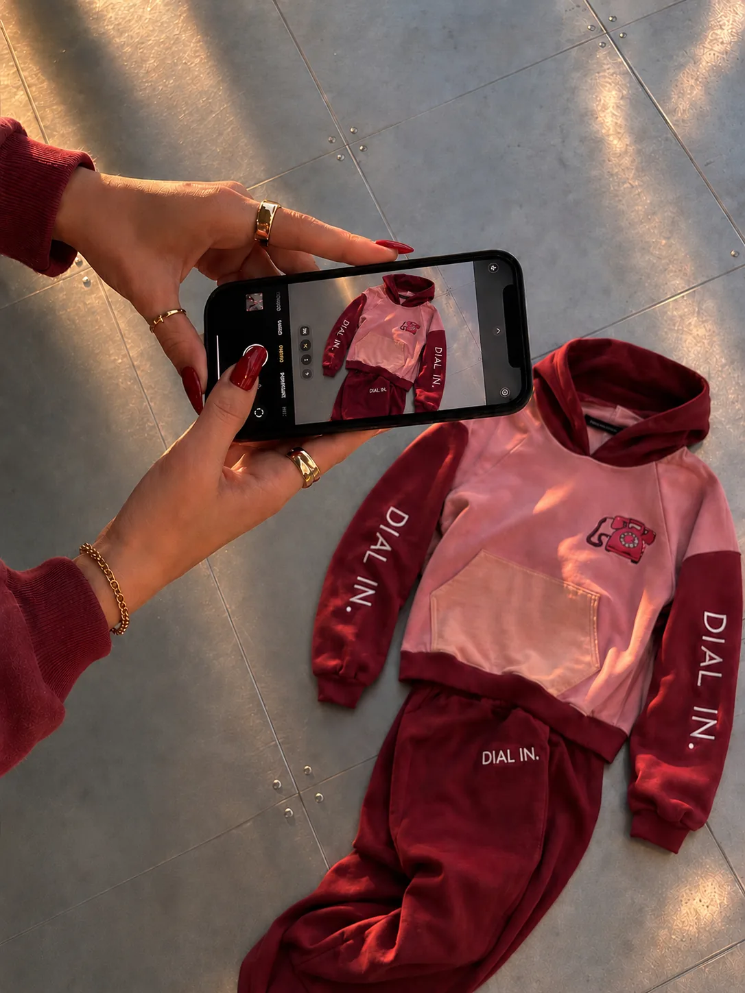 The 411 merch being photographed on a phone